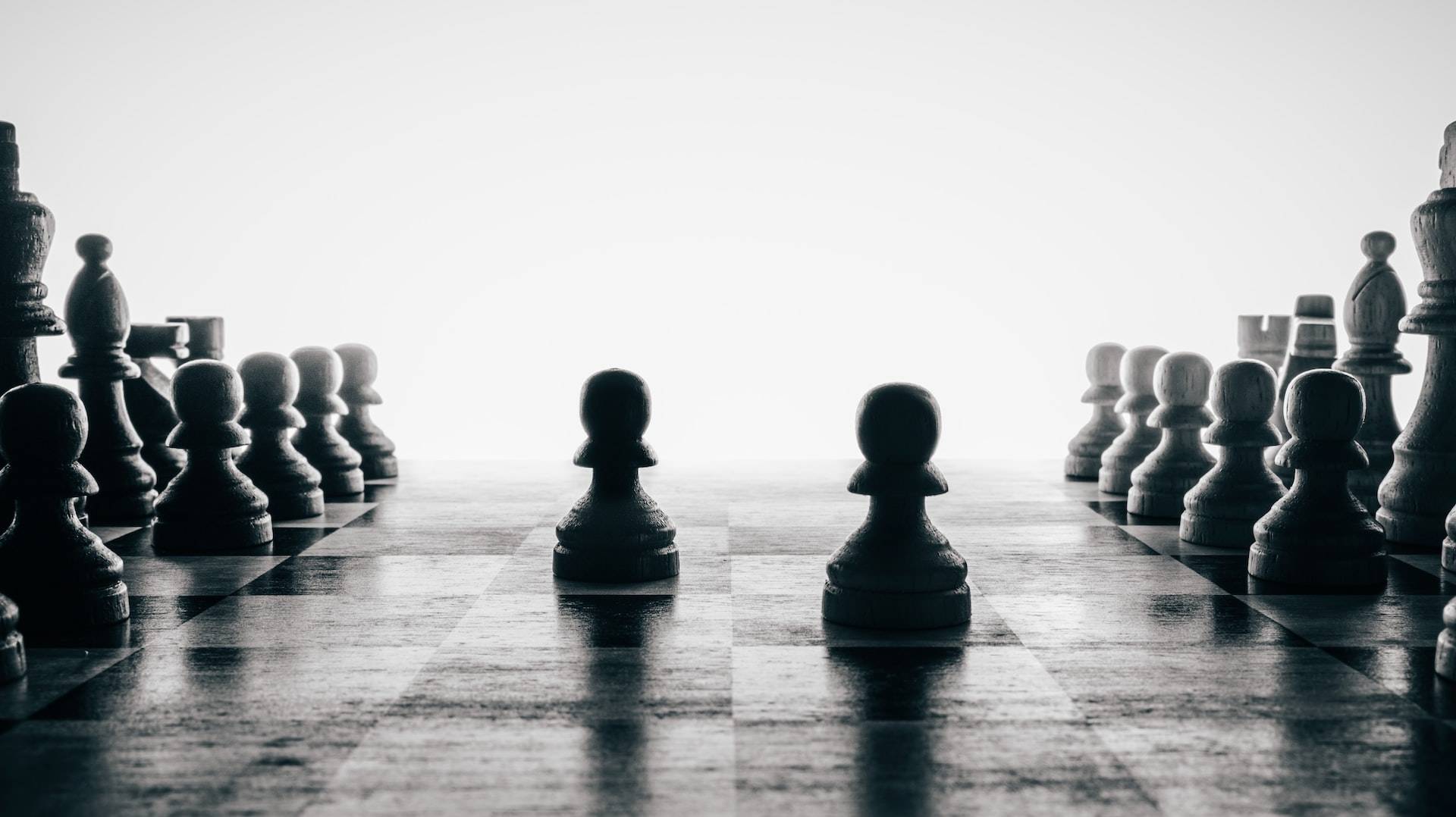 a black and white photo of a chess game